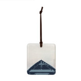 A square hanging ornament with an image of a view over the bow of a boat.