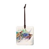 A square hanging ornament with a watercolor image of two sea turtles.