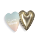A heart shaped container with a pastel lid that says "Chase the Sunburn" offset to the base.