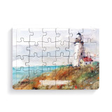 A 24 piece postcard puzzle with a watercolor image of a lighthouse.