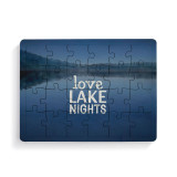 A 24 piece postcard puzzle that says "Love Lake Nights" on a dark blue lake background.