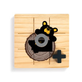 A square wood tic tac toe board with a black bear looking over a tree stump with Montana on it, with a gray O and black X on top.