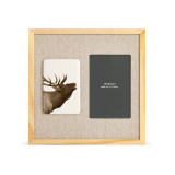 A light wood frame with a white tile on the left with the image of a howling wolf next to a 4x6 photo opening with a linen mat.