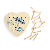 A light yellow heart shaped wood peg game with a beach ball and umbrella and the saying "The Beach is calling" next to a group of wood pegs.