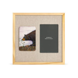A light wood frame with a painted tile on the left showing a black bear sniffing huckleberries, next to a 4x6 photo opening with a linen mat.