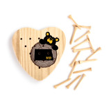 Heart shaped wood peg game with a black bear peeking over a wood stump with North Dakota on it, next to a set of wood pegs.