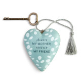 Heart shaped sculpture with a silver tassel and metal key attached. The heart is light green with white leaves and says "Always My Mother, Forever My Friend".
