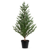 Large fake evergreen tree in a black planter.