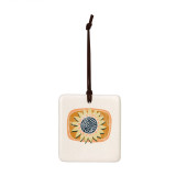 A square hanging tile ornament with a graphic image of a yellow sunflower on an orange background.