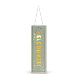 An illuminated teal and light wood tall box that says "Celebrate" cut out of the wood, with a rope handle.