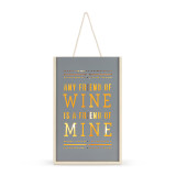 An illuminated gray and light wood tall box that says "Any Friend of Wine is a Friend of Mine" cut out of the wood that holds two bottles of wine, with a rope handle.