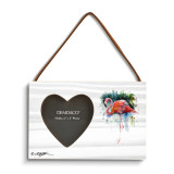A rectangular wood hanging frame with a heart shaped 2 inch photo opening next to a watercolor image of a flamingo.