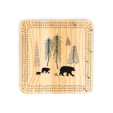 A light wood cribbage board with an illustration of bears walking in a forest.