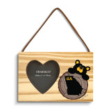 A rectangular wood hanging ornament with a 2x2 inch heart shaped photo opening next to an image of a black bear peeking over a wood stump with Georgia on it.