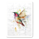 A 24 piece puzzle postcard with the watercolor image of a hummingbird.