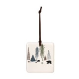 A square cream hanging tile magnet ornament with an illustration of bears in a forest.