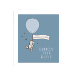 A blue biodegradable dish cloth that says "Enjoy The Ride" with Pooh hanging from a balloon that says "mountains or bust".