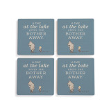 A set of four blue square ceramic coasters that say "A Day at the lake Keeps the Bother Away" with an image of Pooh and Piglet.