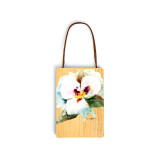 A light wood hanging gift card ornament with a watercolor image of a sego lily on the front. The back has a holder for a gift card.