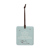 A square light blue hanging tile magnet ornament that says "Even Rainy Days at the beach are Good Days", with an image of Eeyore at the bottom.