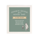 A green biodegradable dish cloth that says "Pooh's Guide for a Good Day in the woods" with an image of Pooh and Piglet.