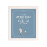 A blue biodegradable dish cloth that says "A Day at the lake Keeps The Bother Away" with an image of Pooh and Piglet at the bottom.