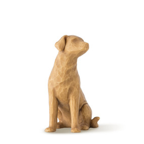 Figure of large light brown dog sitting on back legs, facing right