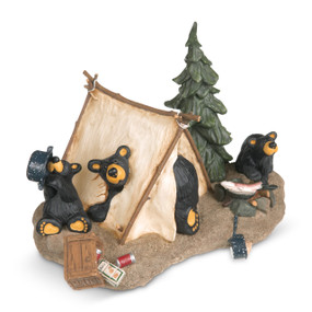 A figurine of three playful black bears rummaging through a canvas tent and campsite.