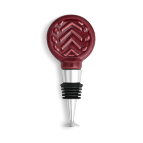 wine bottle stopper with maroon glazed ceramic circle with diagonal line design on it