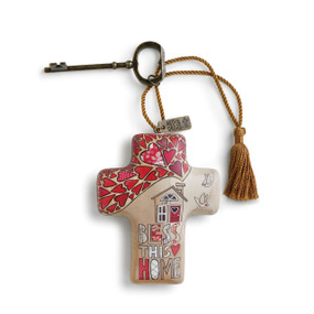 Bless this home' printed on tan cross with image of house and red heart design keychain with brown tassle