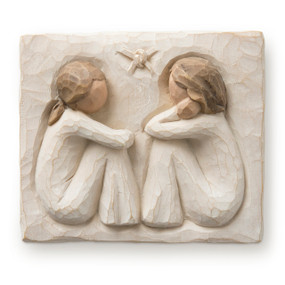 Flat rectangular cream-colored plaque with bas-relief carving of two seated females in cream dresses facing each other