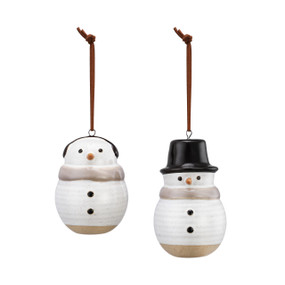 Two white ceramic ceramic ornaments. One with a black top hat and one with black earmuffs.