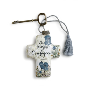 Be strong & courageous' in black letters on white cross figurine with blue flower print keychain with blue tassle