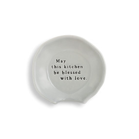 gray ceramic spoon rest with May this kitchen be blessed with love etched into the center in black