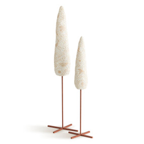 Set of two cream colored slender tree shapes, carved with organic designs and dotted with gold, elevated on metal rods with stands