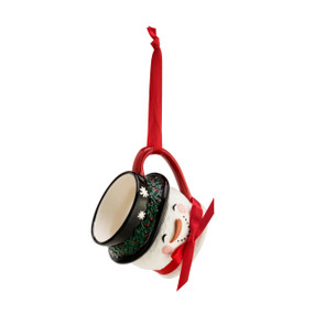 A red, white, and black Snowman Coffee Pod Mug Ornament with a red bow and a red ribbon.