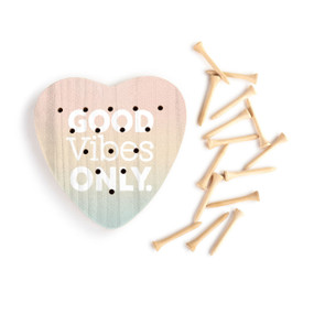 A light wood heart shaped peg game that says "Good Vibes Only" next to a group of wood pegs.