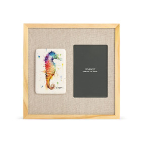A light wood frame with a tile on the left that has a watercolor image of a seahorse, next to a 4x6 photo opening with a linen mat.