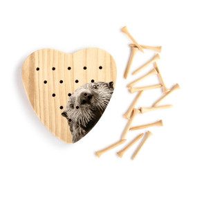 A heart shaped wood peg game that has the image of an otter, next to a set of wood pegs.