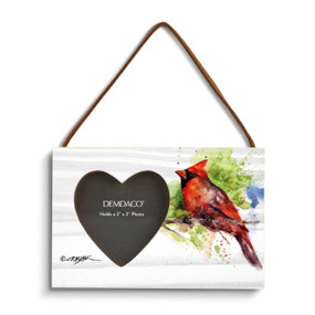 A rectangular wood hanging frame with a heart shaped 2 inch photo opening next to a watercolor image of a cardinal on a branch.