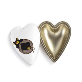 Heart shaped keeper with the image of a black bear peeking over a tree stump with Colorado on it, with the lid offset to the base.