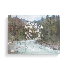 A 24 piece postcard puzzle that says "Where America is still Wild" on a mountain stream background.