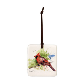 A square hanging ornament with a watercolor image of a cardinal on a branch.