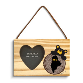 A rectangular wood hanging ornament with a 2x2 inch heart shaped photo opening next to an image of a black bear peeking over a wood stump with Maine on it.