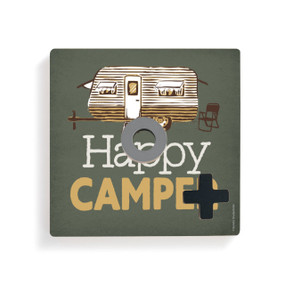 A dark green square board with a camper and the saying "Happy Camper" for tic tac toe with a gray O and black X on top.