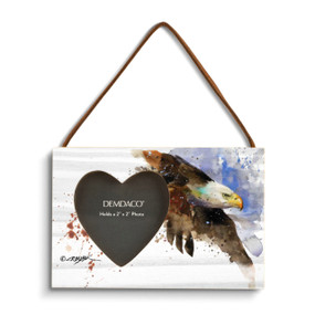 A rectangular wood hanging frame with a heart shaped 2 inch photo opening next to a watercolor image of a bald eagle in flight.