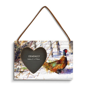 A rectangular wood hanging frame with a heart shaped 2 inch photo opening next to a watercolor image of a ringneck.