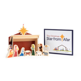 Wood nativity figures, a stable and a book titled "The Christmas Star from Afar".