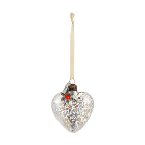 Blown glass silver heart shaped ornament with a silver snowflake token attached with a red stone in the center for July.