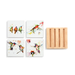 A set of four white stoneware coasters with different watercolor images of hummingbirds next to a square wood holder with four slats.